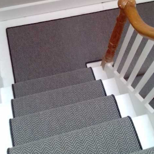 Grey herringbone runner with drak border whipping